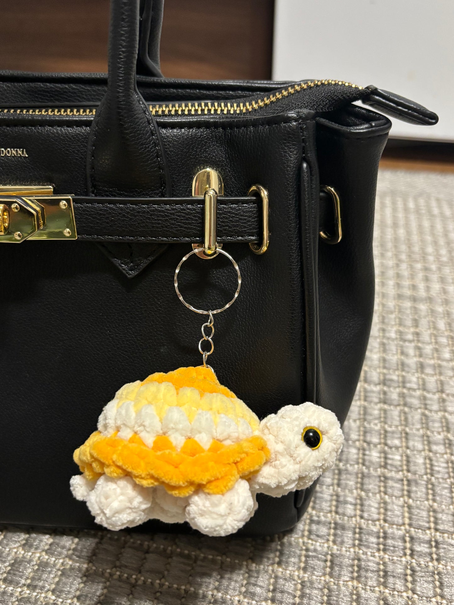 Kilpikonna avaimenperä (useita värejä)